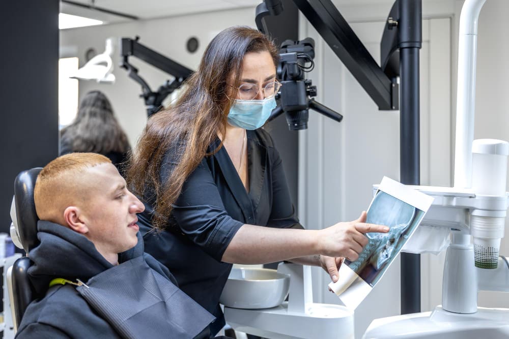 Dentist working with a patient using modern tools